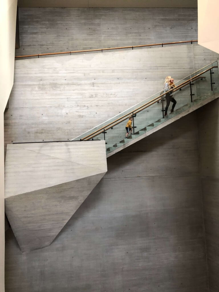 Family walking up stairs in the Utah Natural History Museum.